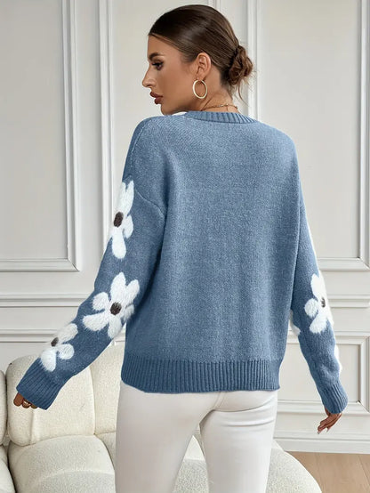 Effortless style: women's floral print knit sweater with comfortable drop shoulder and long sleeves.