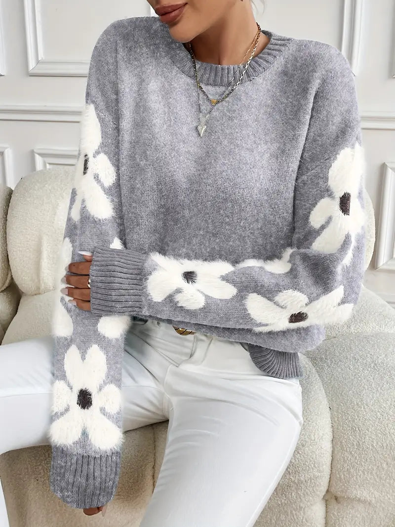 Floral pattern women's knit sweater with drop shoulder sleeves, offering a stylish and cozy fit.