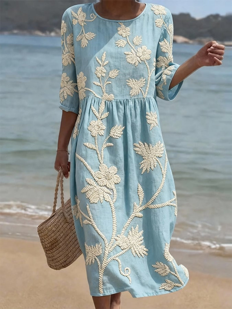 Women's floral embroidered midi dress with three-quarter sleeves, perfect for spring casual or vacation wear.