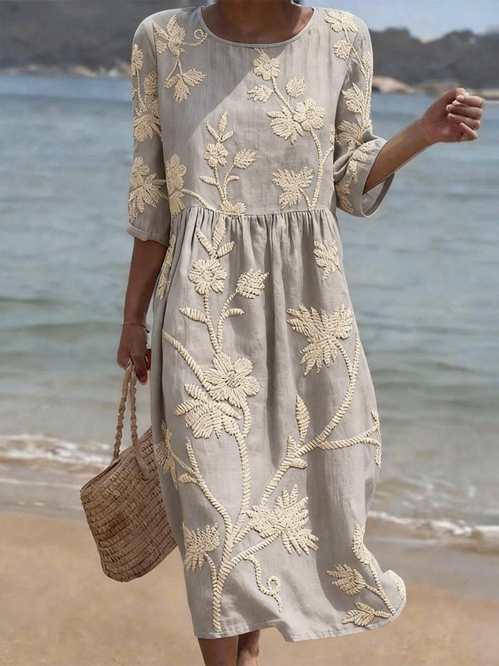 Versatile women's midi dress, floral embroidery & three-quarter sleeves, comfortable for spring/summer elegant casual.