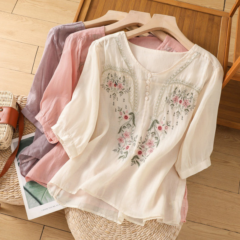 Women's floral embroidered relaxed blouse with V-neck, ideal for casual chic spring & summer fashion.