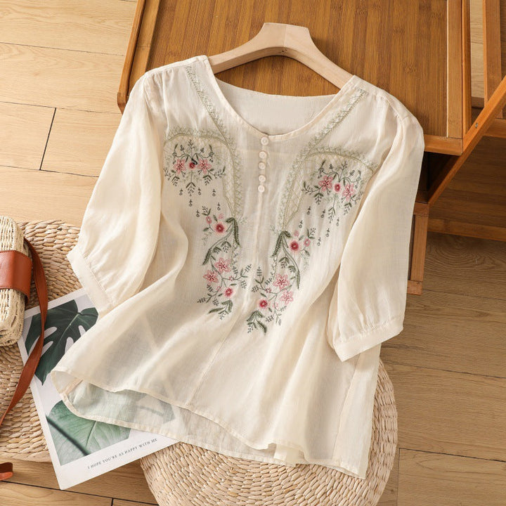 Casual chic women's floral embroidered V-neck blouse, relaxed fit, long sleeve. Perfect versatile spring top.