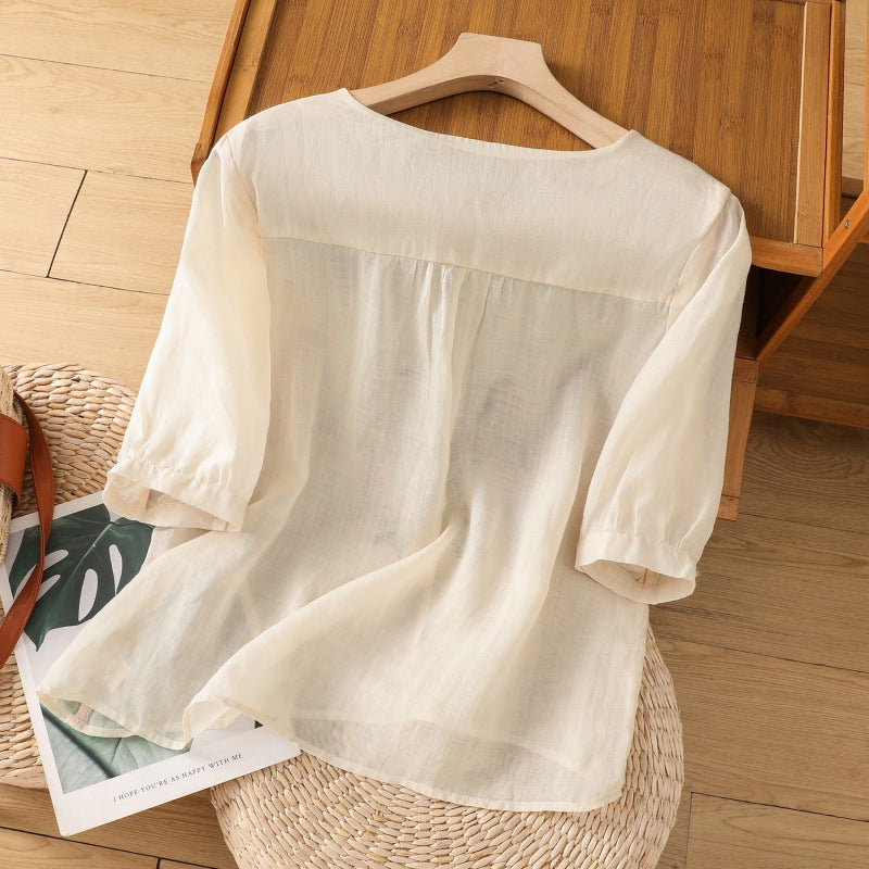 Comfortable women's relaxed fit floral embroidered blouse, a stylish V-neck top for spring & summer elegance.