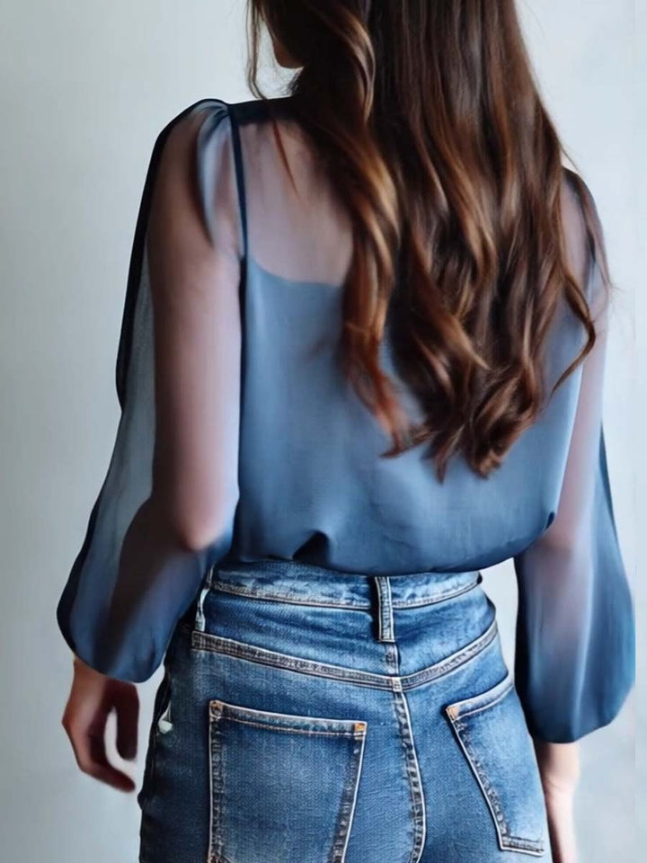 Elegant V-neck blouse for women, featuring intricate floral embroidery and relaxed-fit sheer long sleeves.