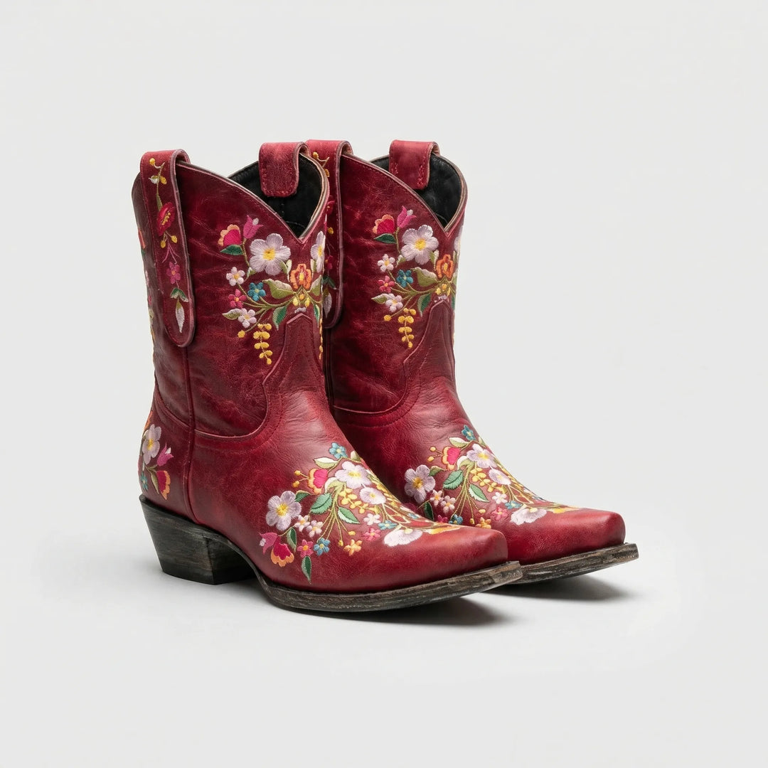 Boho chic women's western ankle boots with vibrant floral embroidery, ideal for festivals & country fashion.