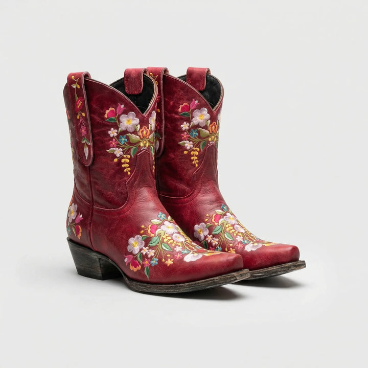 Boho chic women's western ankle boots with vibrant floral embroidery, ideal for festivals & country fashion.