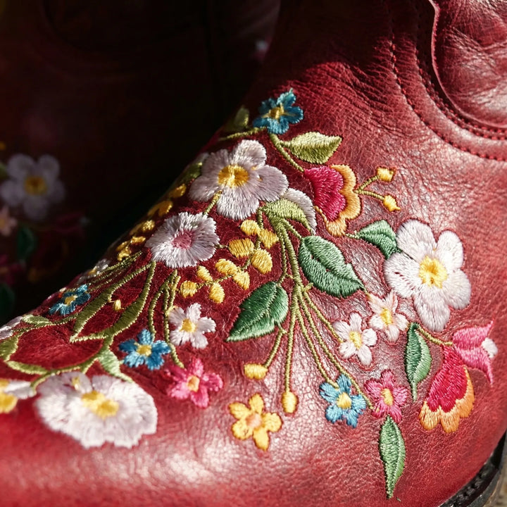 Durable pull-on women's western ankle boots, detailed floral embroidery. Comfortable for everyday wear.