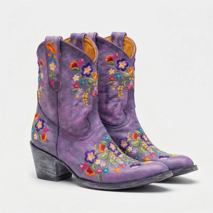 Comfortable women's floral embroidered western ankle boots. Durable pull-on style, great for cowgirl or festival looks.