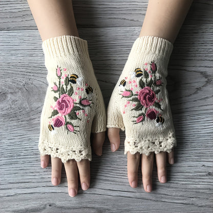 Women's floral fingerless knit gloves, perfect for winter fashion. Embroidered boho style, warm & chic.