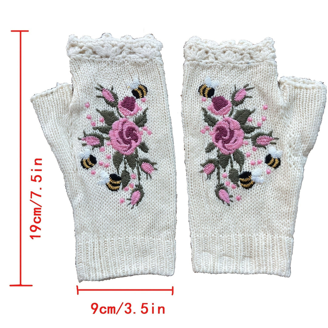 Hand-knitted women's fingerless gloves with beautiful floral embroidery. Cozy crochet winter fashion accessory.