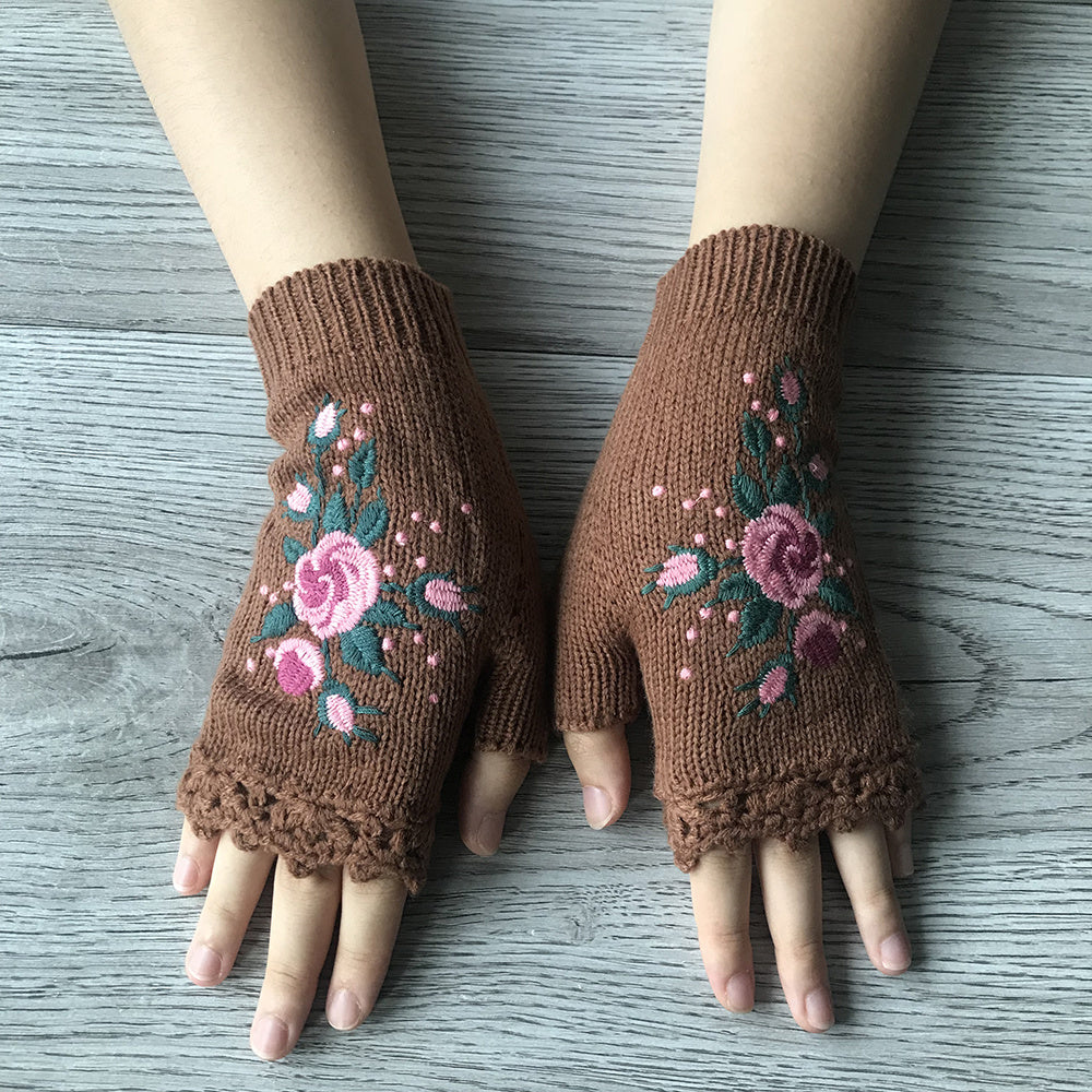 Boho style women's floral fingerless knit gloves, intricately embroidered. A fashionable winter accessory.