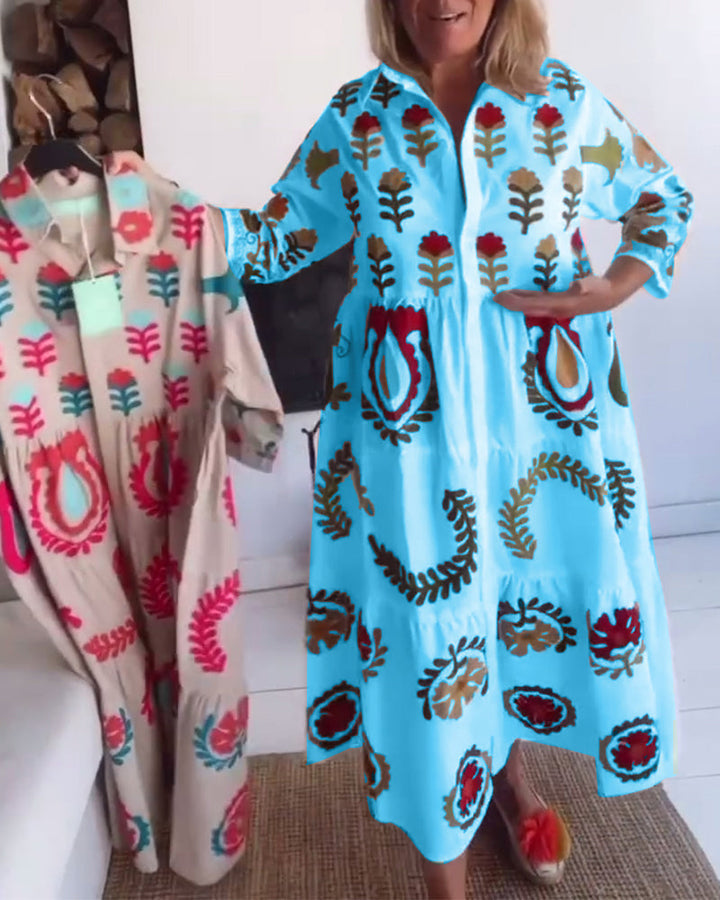 Stylish women's midi dress with a colorful floral graphic print, A-line design, and lapel detail.