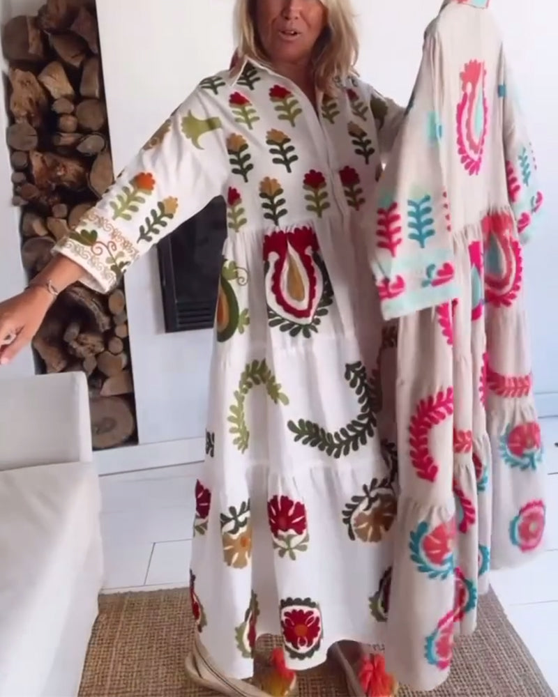 Chic women's floral graphic print A-line midi dress. Features a fashionable lapel collar. Summer essential.