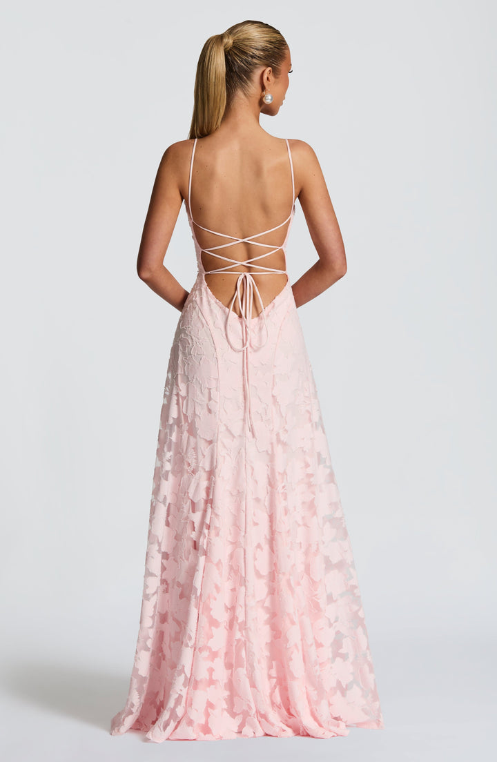 Detail shot of the waterfall neckline on a women's floral maxi dress, showing soft drapes.