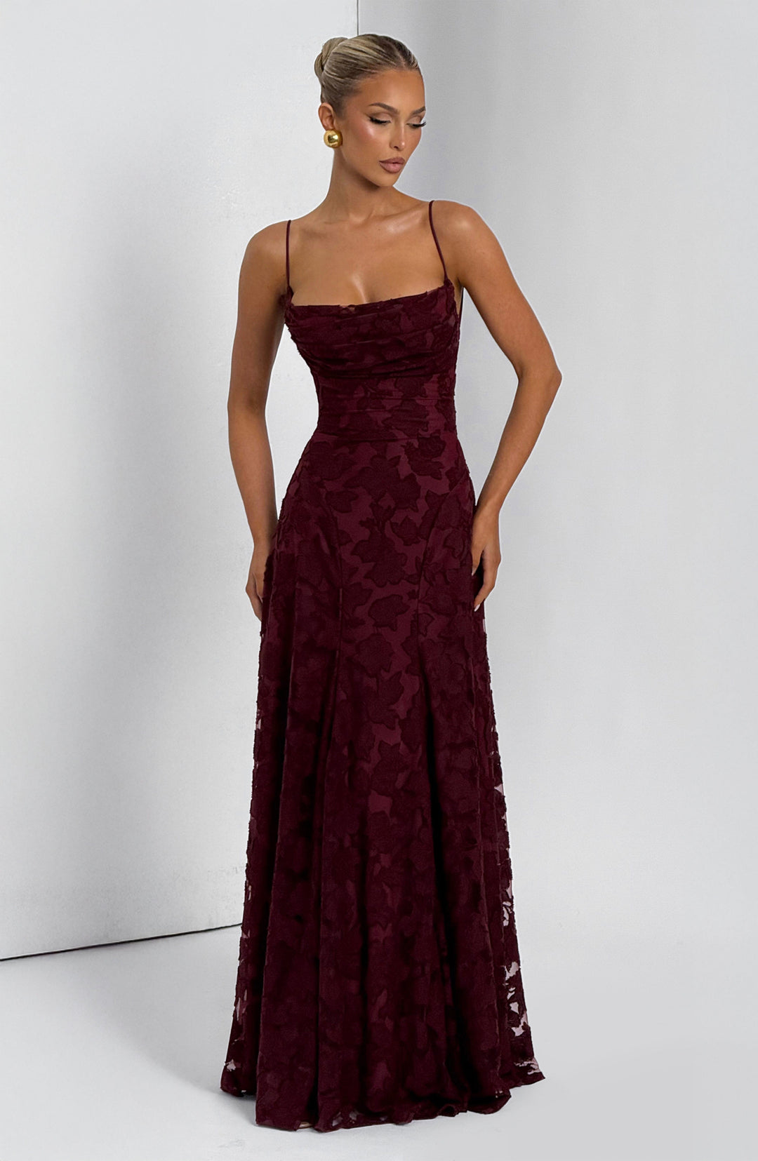 Detail shot of the lace-up back on a women's floral maxi dress, intricate and adjustable design.