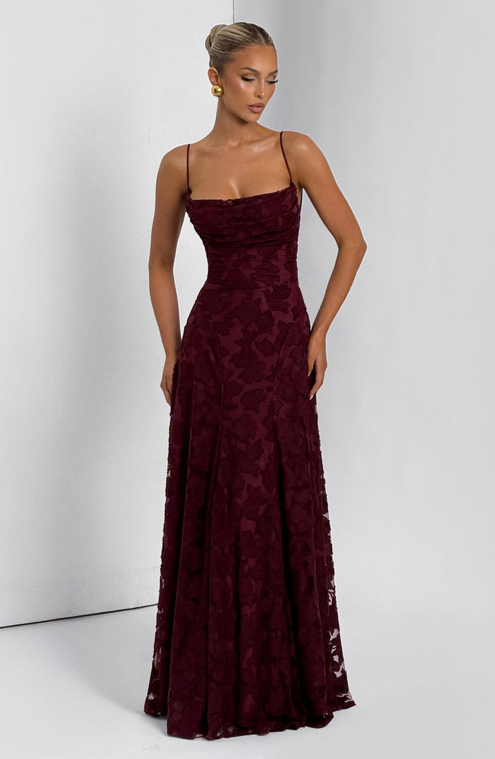 Detail shot of the lace-up back on a women's floral maxi dress, intricate and adjustable design.