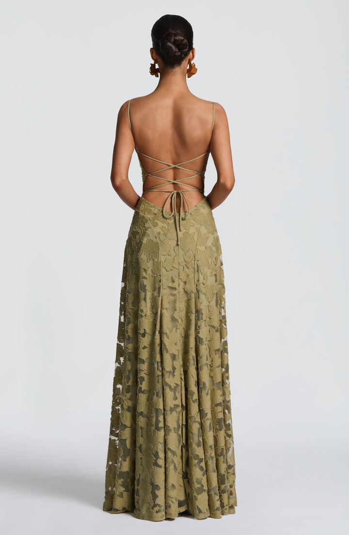 Close-up of women's floral maxi dress featuring stylish lace-up back detail & elegant waterfall neckline.