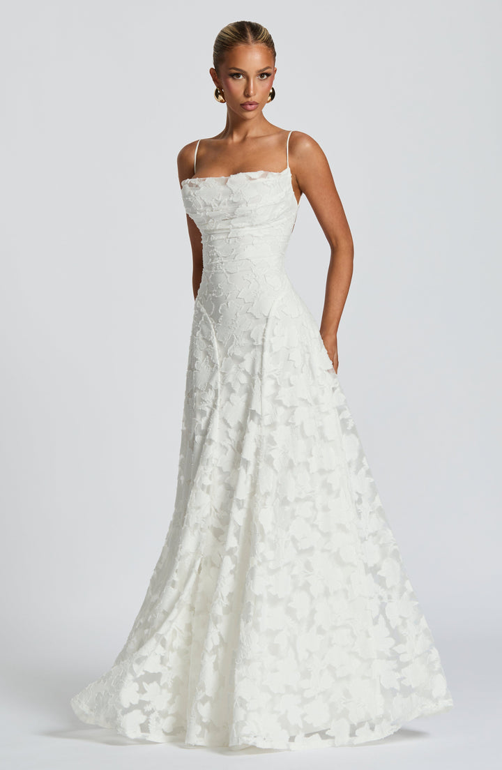 Elegant women's floral maxi dress for special occasions, featuring a cowl neck & delicate lace-up back.
