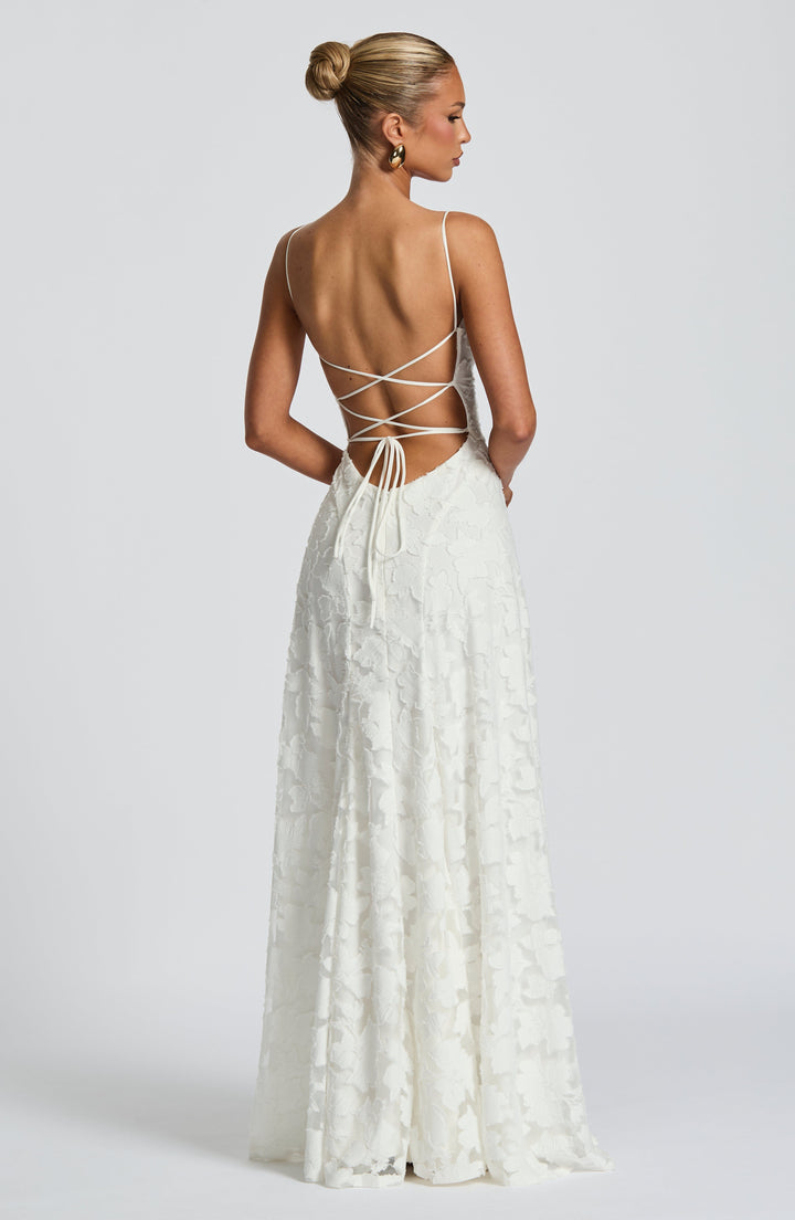 Feminine floral maxi dress with a flattering waterfall neckline, A-line silhouette, and comfortable design.