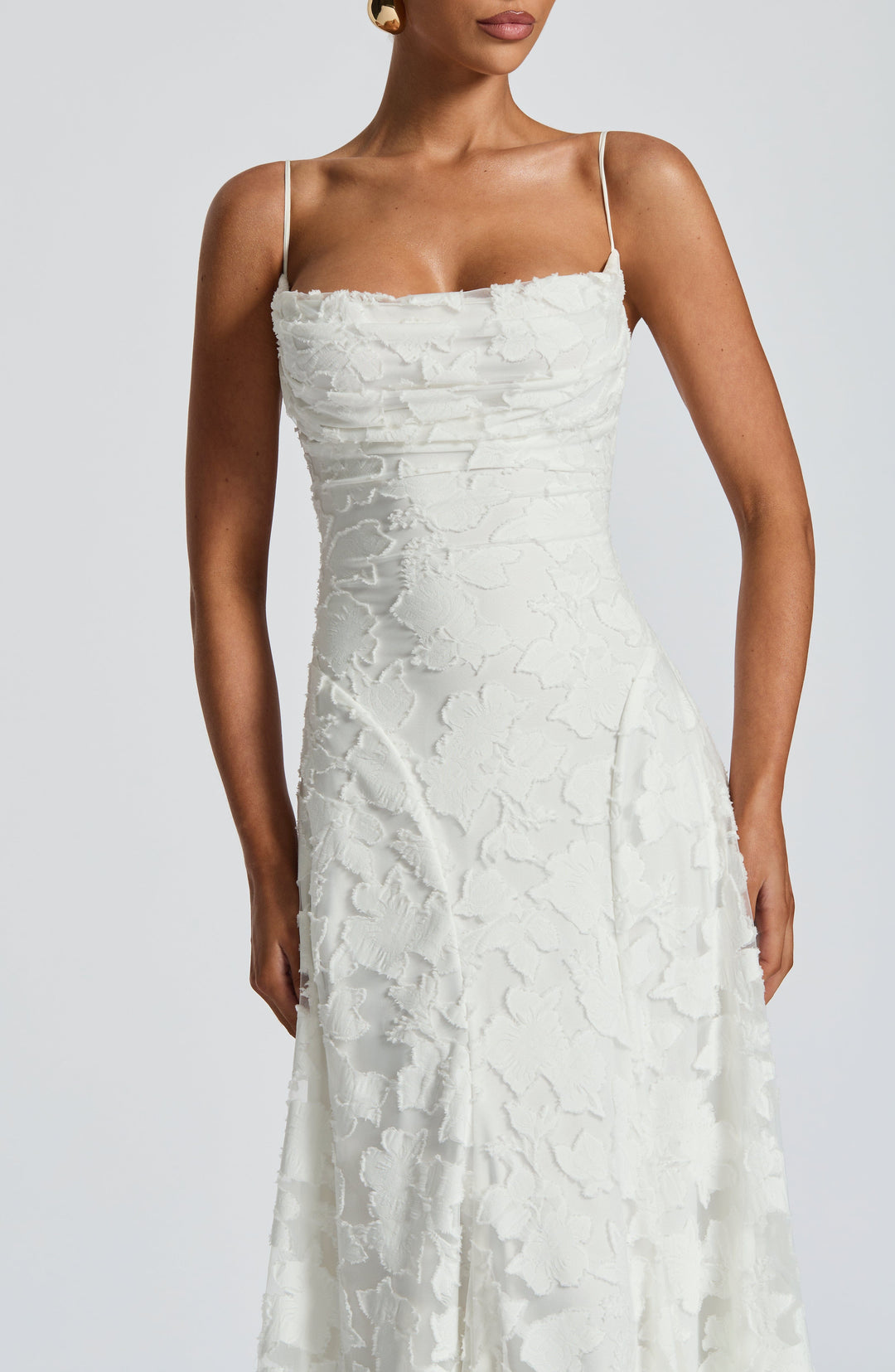 Women's floral maxi dress, showcasing a unique waterfall neckline and trendy lace-up back.