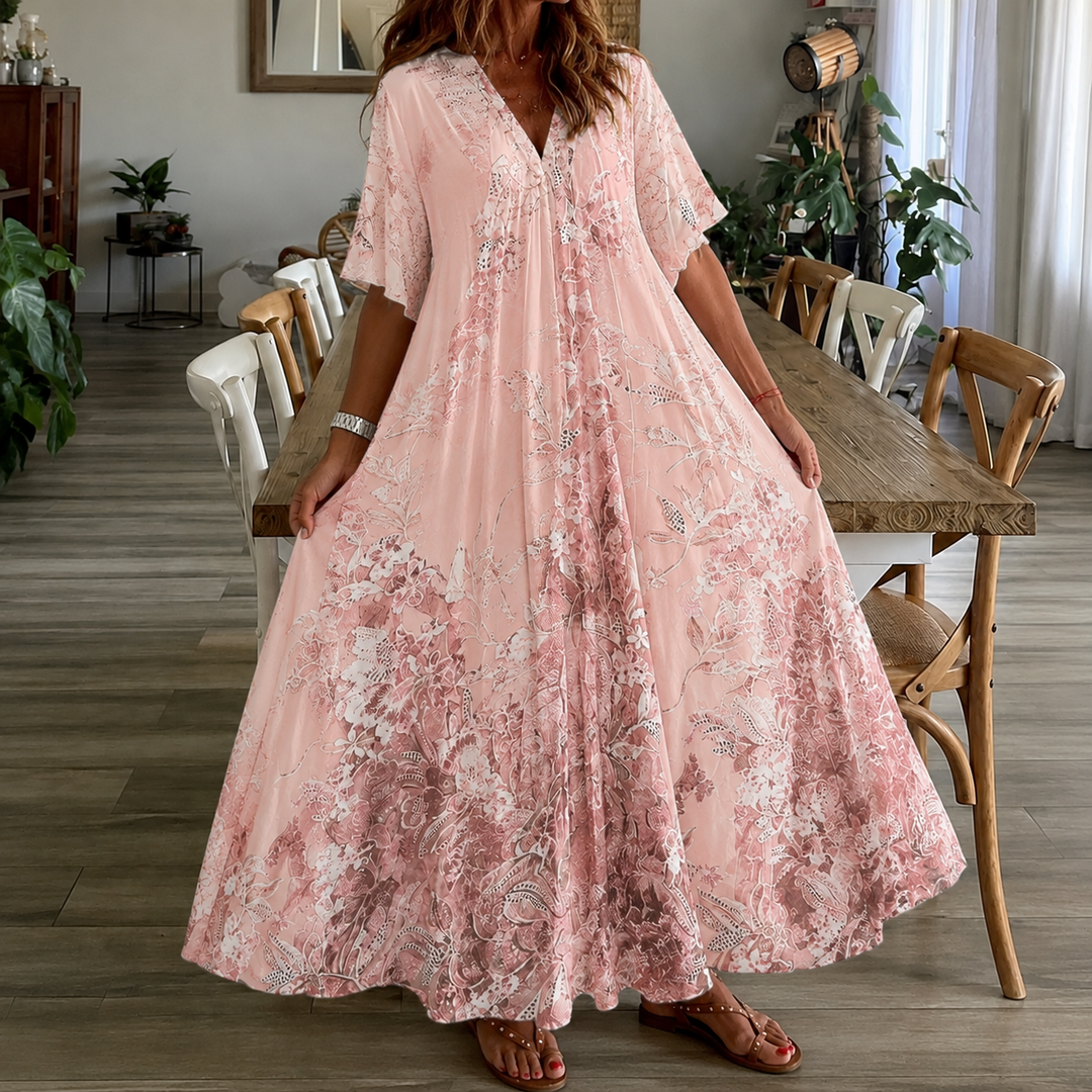 Vibrant floral maxi dress for women featuring a split neck & half sleeves, versatile for summer outings & beach.