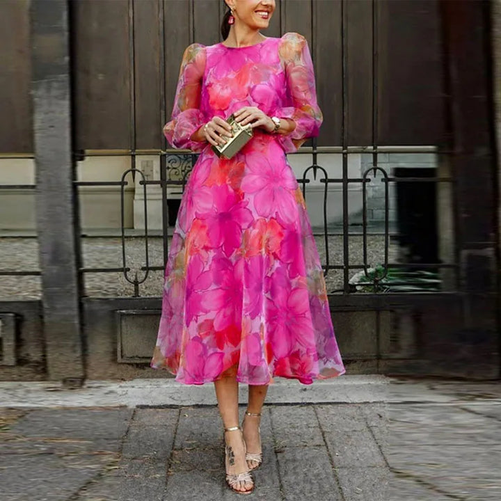 Women's floral midi A-line dress with puff sleeves, ideal for wedding guests & special occasions.