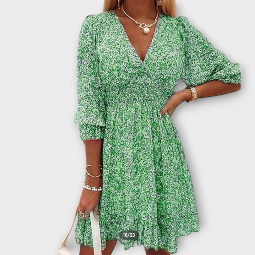Elegant pink floral A-line midi dress for women, featuring stylish puff sleeves, ideal for day wear.