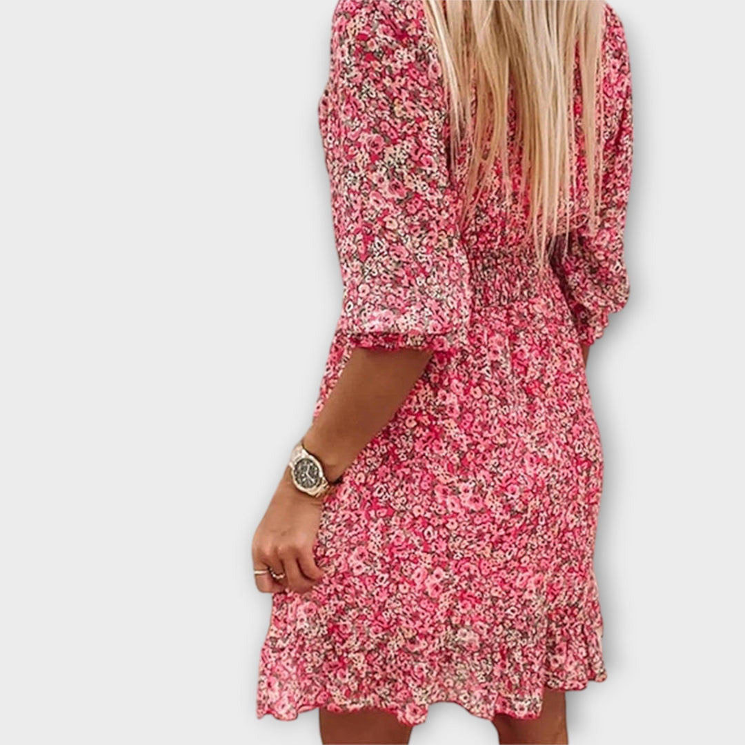 Versatile women's floral A-line midi dress with puff sleeves, great as a casual or elegant summer dress.