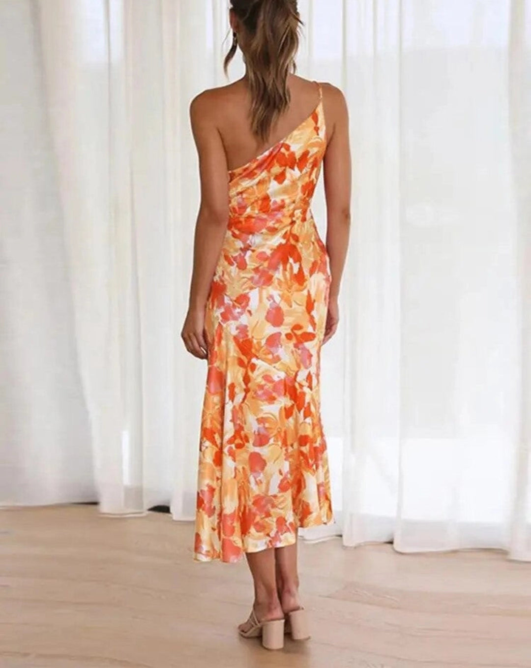 Summer women's floral one-shoulder midi dress. An elegant and vibrant choice for any wedding guest.