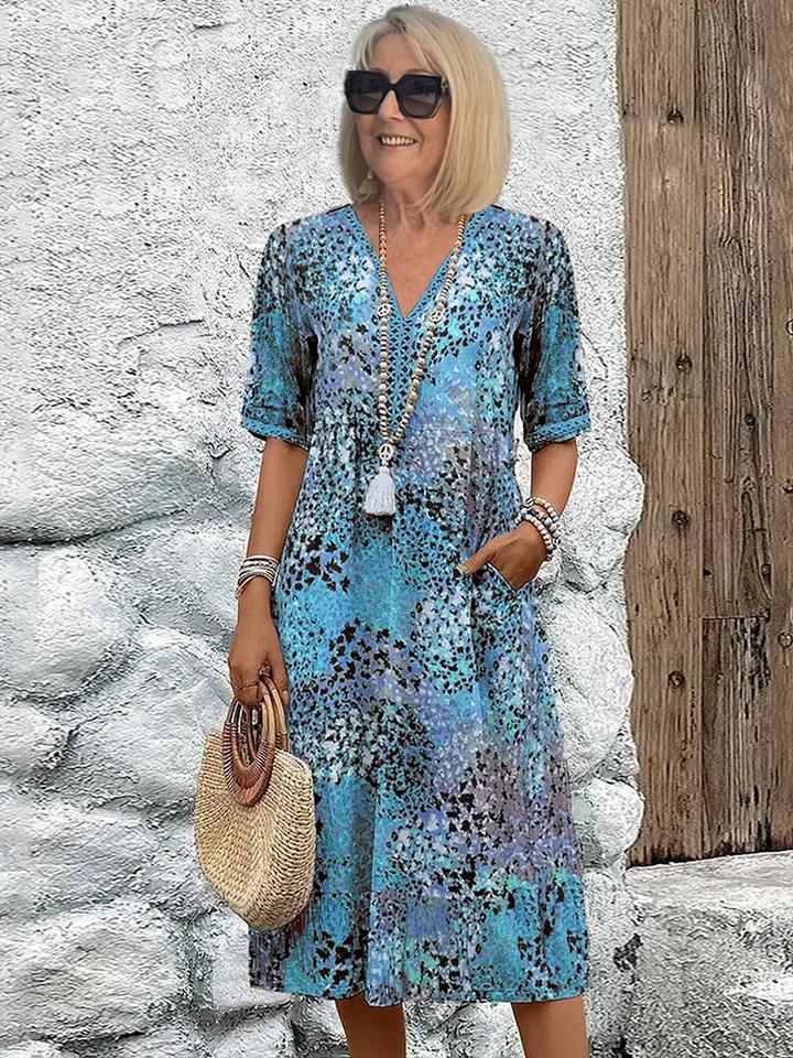 Elegant V-neck A-line floral print midi dress for women, ideal for versatile summer fashion.