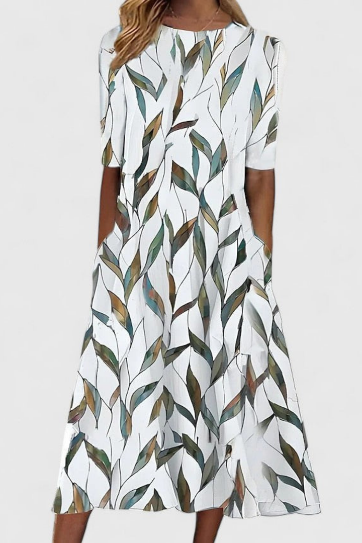 Flowy women's floral print midi dress with round neck, short sleeves & A-line silhouette, perfect for summer vacation.