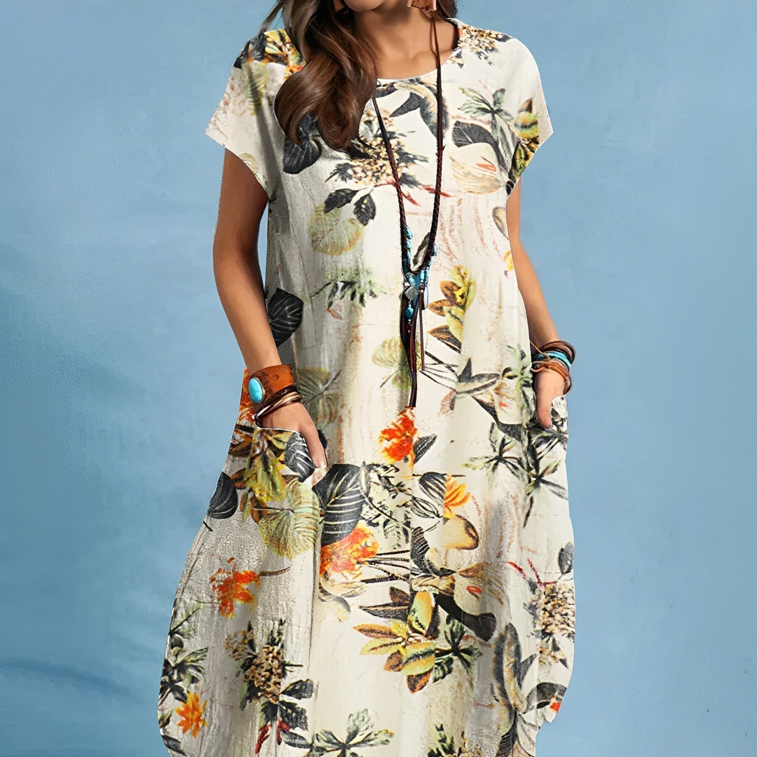 Elegant women's floral print midi dress featuring a round neck, short sleeves, & practical side pockets.