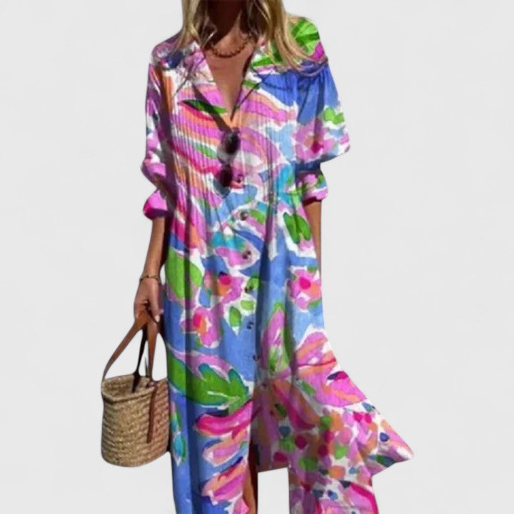 Flowy women's floral print midi shirtdress, showing pintuck pleats & collared V-neck. Comfortable casual chic summer style.