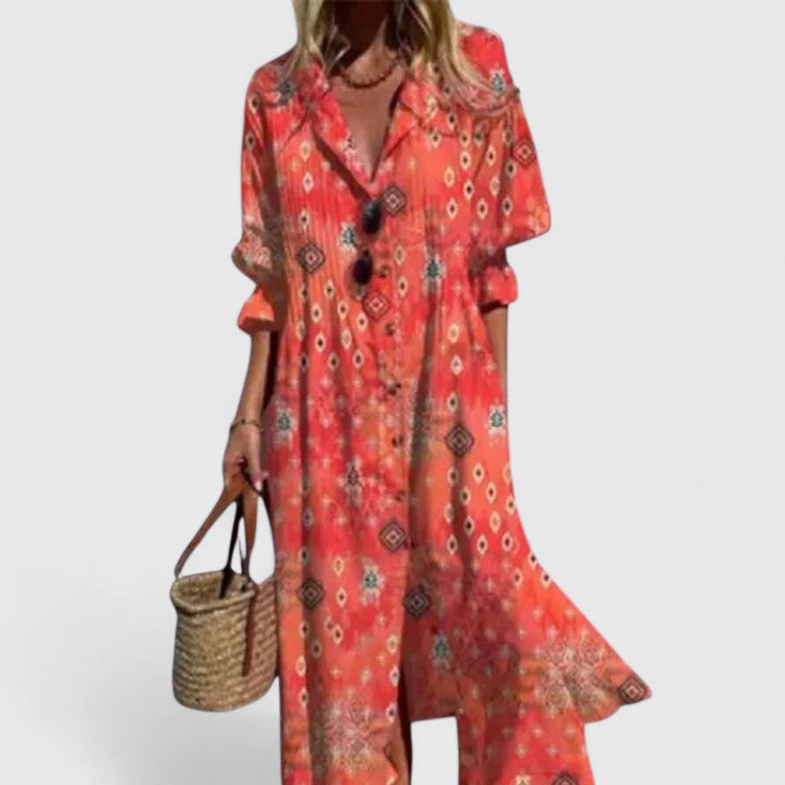 Detail of the collared V-neck & button-down front of a women's floral print pintuck pleated midi shirtdress. Summer look.