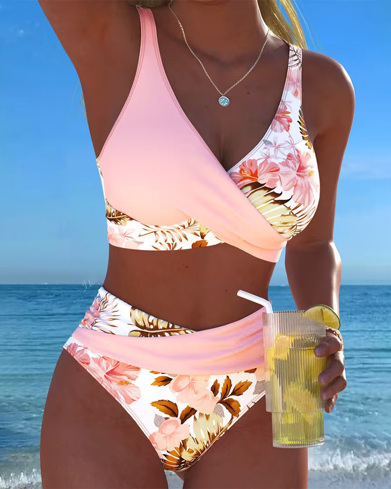 Women's floral print split bikini swimsuit, a stylish two-piece for summer beachwear.