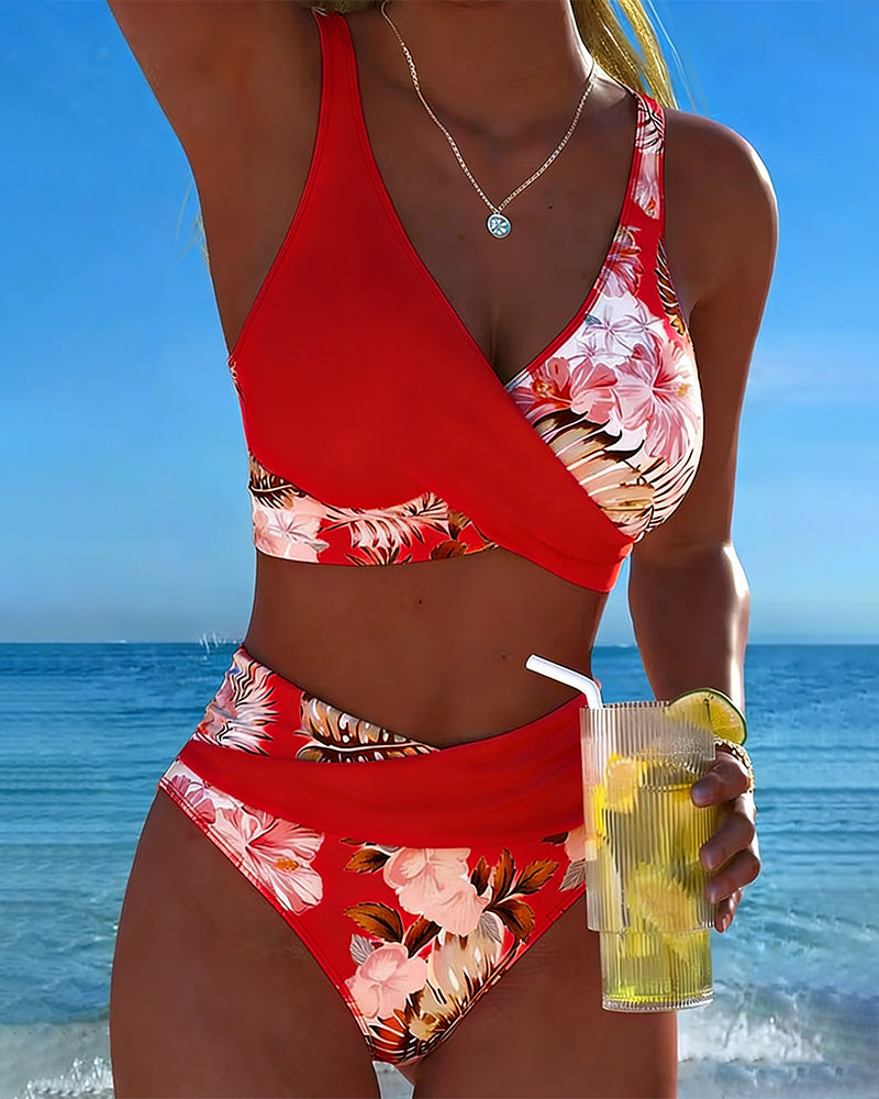 Women's floral print split bikini, a fashionable two-piece swimsuit for summer adventures.