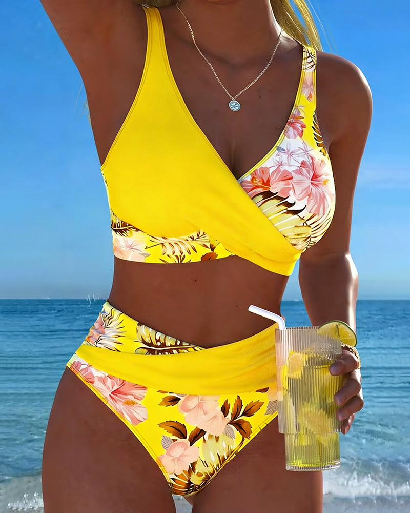 Chic women's floral split bikini, essential beachwear for summer and poolside fun.