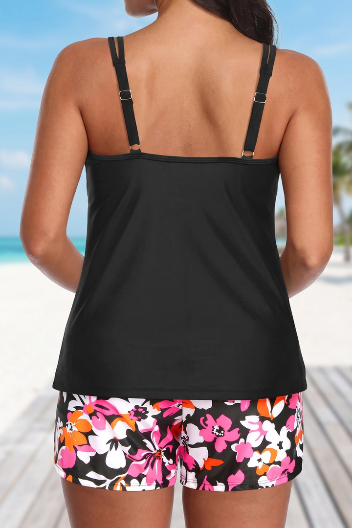 Elegant floral print women's tankini set. Two-piece swimwear with comfortable swim shorts for resort wear.