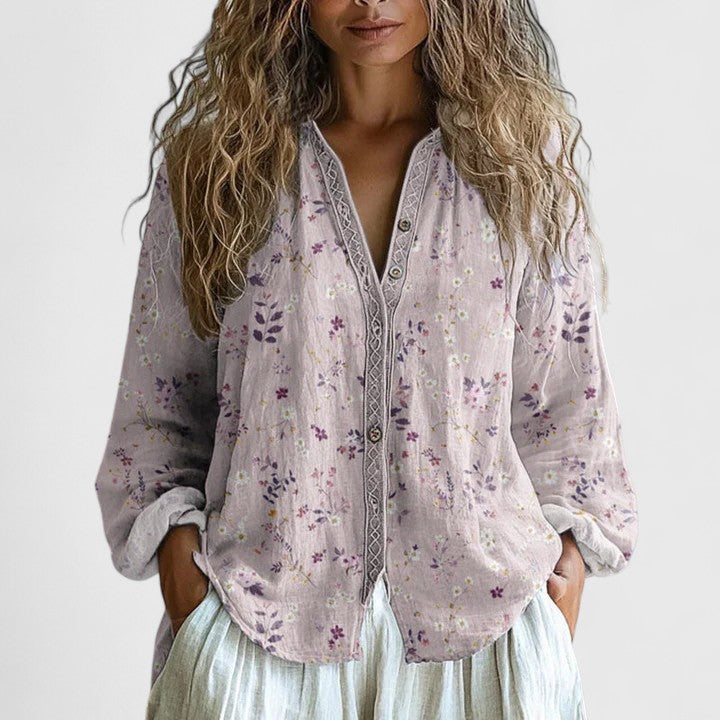 Lightweight pink floral print zip-front blouse for women, a versatile layering piece for casual wear.