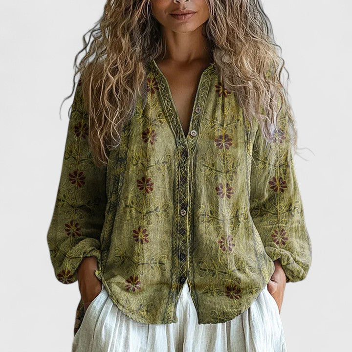 Purple & green floral print long sleeve blouse with a zip-front V-neck, ideal for effortless everyday fashion.