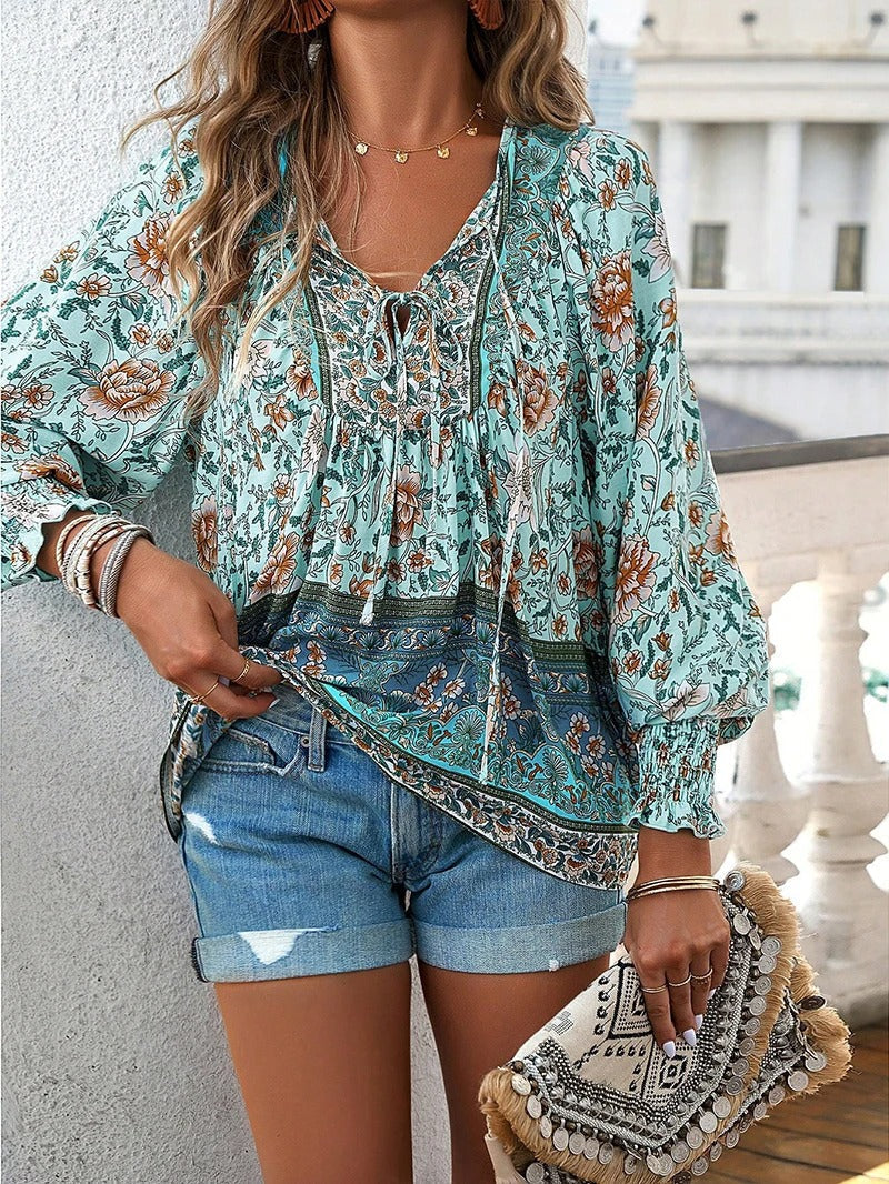 Lightweight women's floral summer top with puff sleeves, great for vacation & spring fashion.