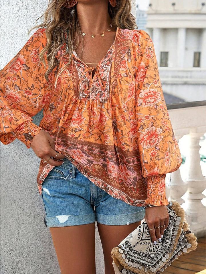 Chic women's floral puff sleeve top, soft fabric, perfect for stylish summer and spring casual wear.