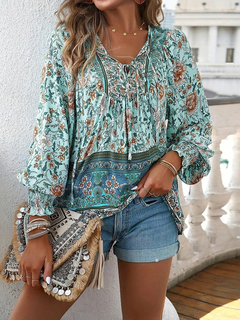 Fashionable women's floral top with puff sleeves, an elegant choice for summer & spring outfits.