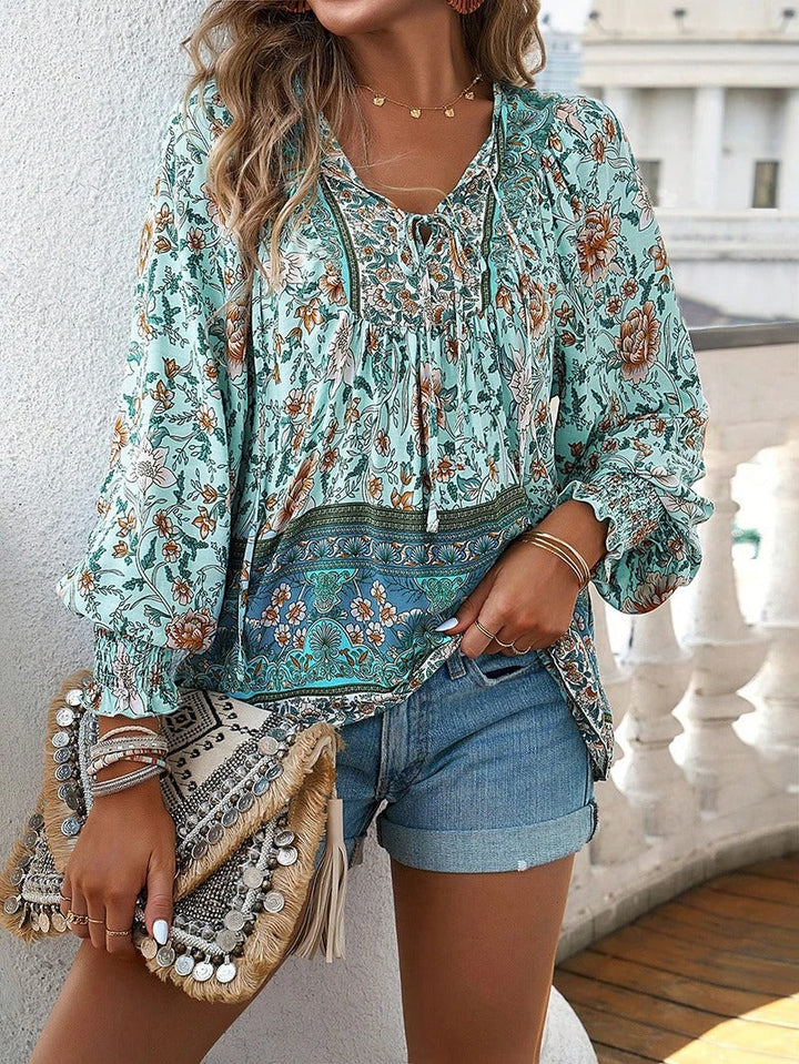 Fashionable women's floral top with puff sleeves, an elegant choice for summer & spring outfits.