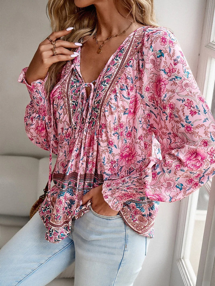 Women's elegant floral puff sleeve top, ideal for summer casual wear & spring fashion.