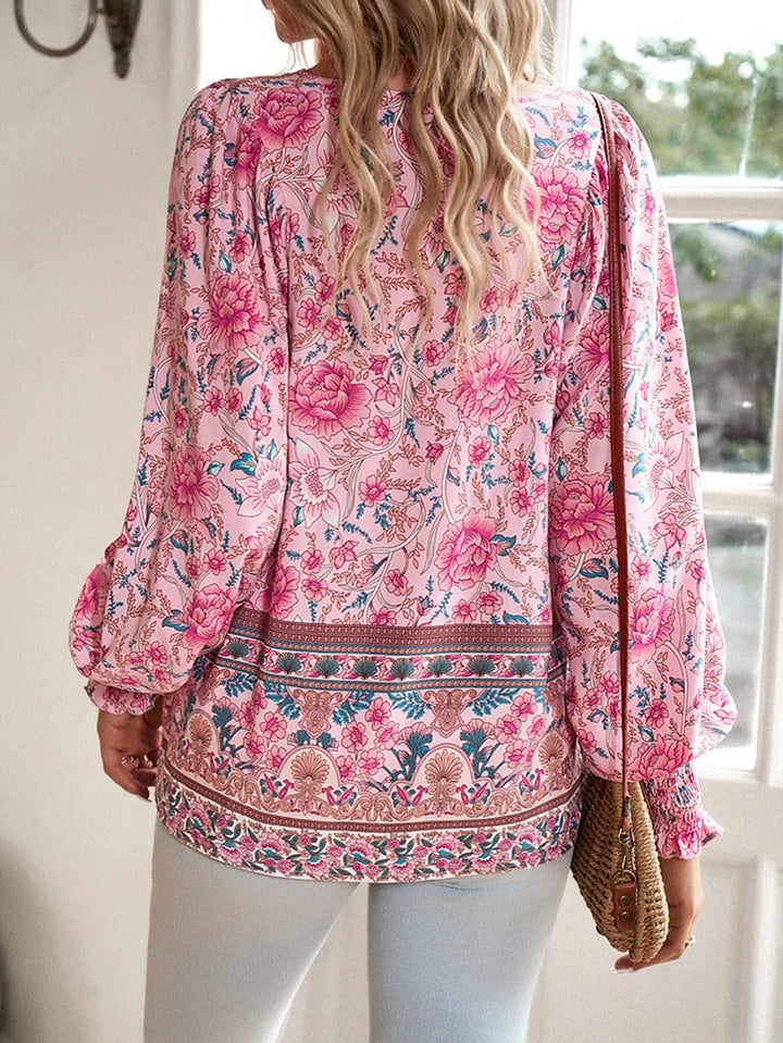 Enjoy summer style with this women's floral puff sleeve top, lightweight & perfect for vacations.