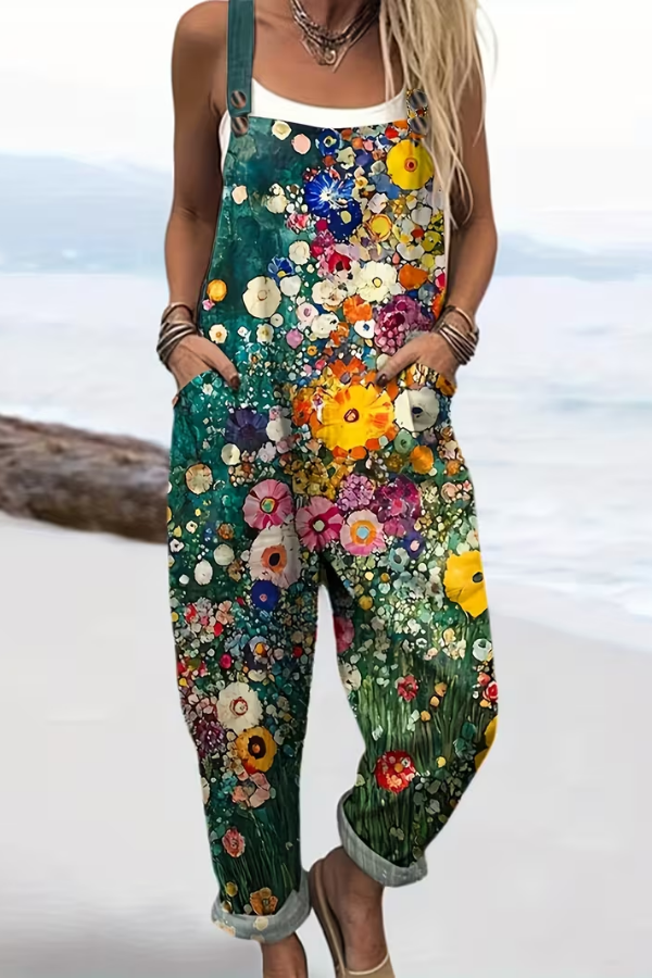 Effortless women's floral jumpsuit, ideal for summer vacation or casual wear. Sleeveless, relaxed fit with button details.