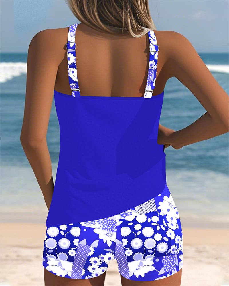 Women's floral tankini swimsuit with shorts, a stylish and modest two-piece beachwear for summer vacations.