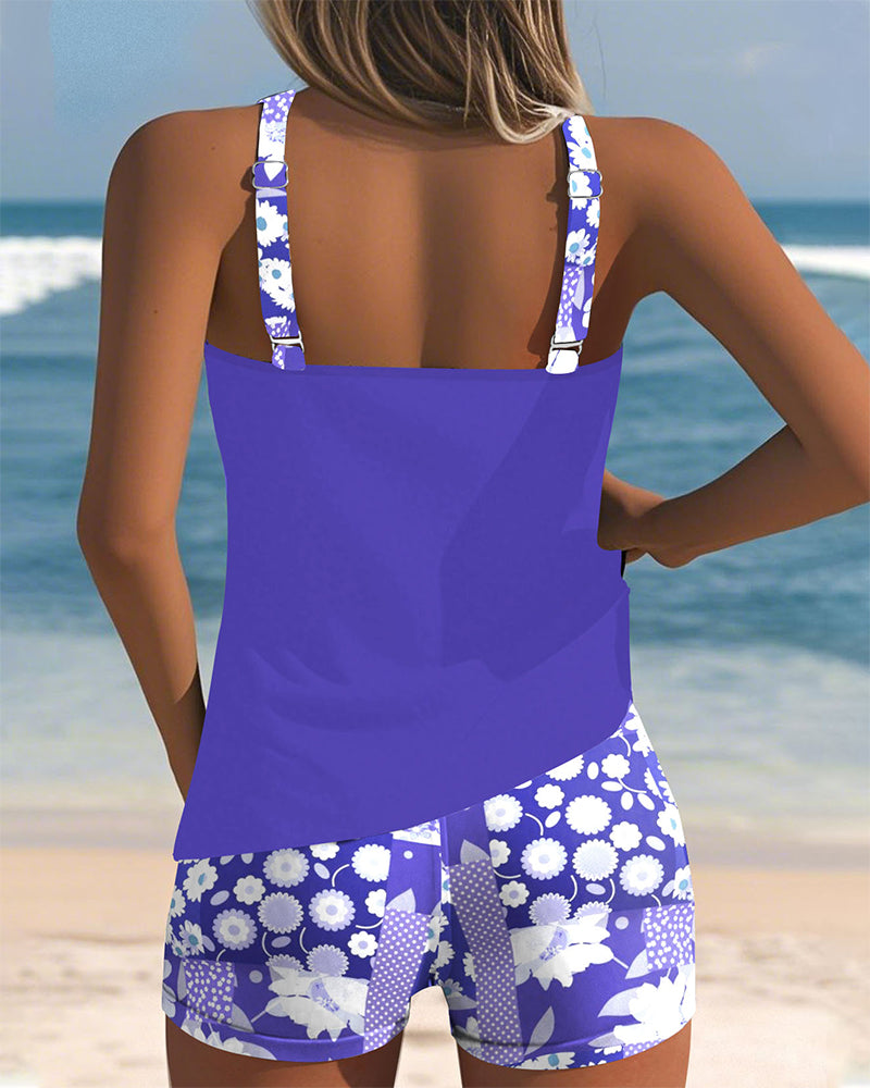 Comfortable women's floral two-piece tankini swimsuit with modest swim shorts, chic beachwear for vacation.