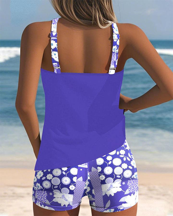 Comfortable women's floral two-piece tankini swimsuit with modest swim shorts, chic beachwear for vacation.